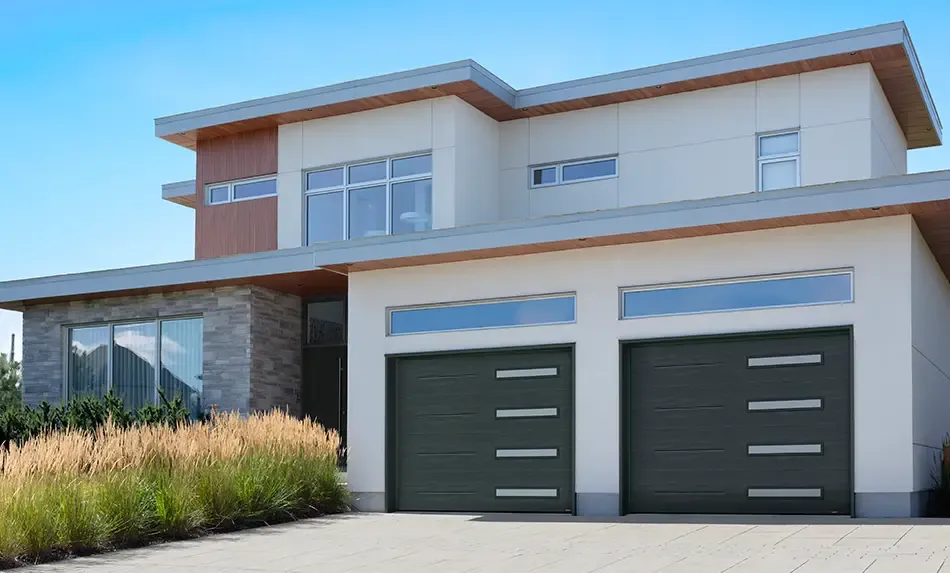 Garaga latest garage door styles with slim horizontal windows and Garaga door new Iron Ore color perfect for Japandi exteriors.